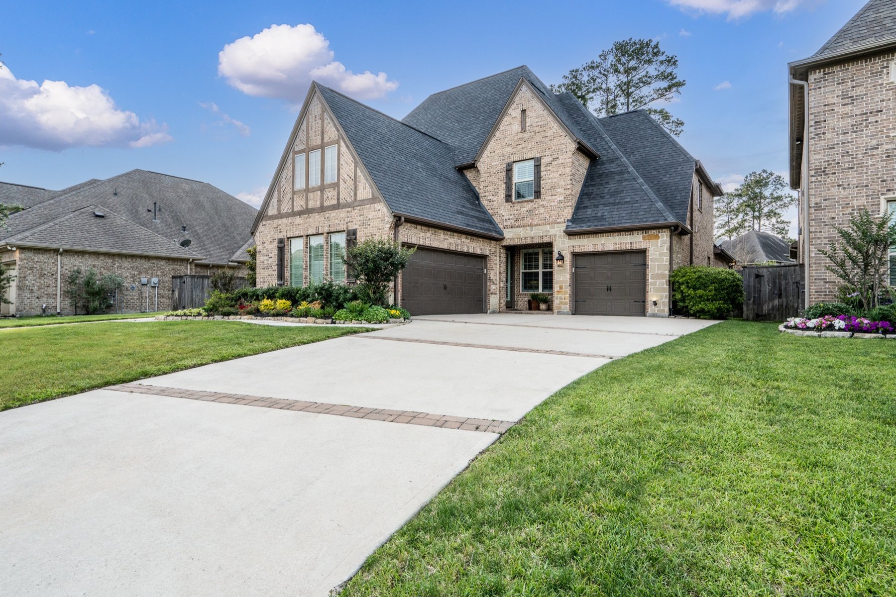 Brick home with a steep gable and a wide front walk